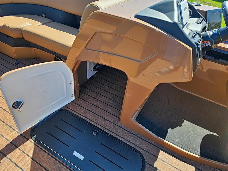 Slide: The Image of 2025 Bentley Pontoons 223 Elite interior with open storage and captain's console. - 24