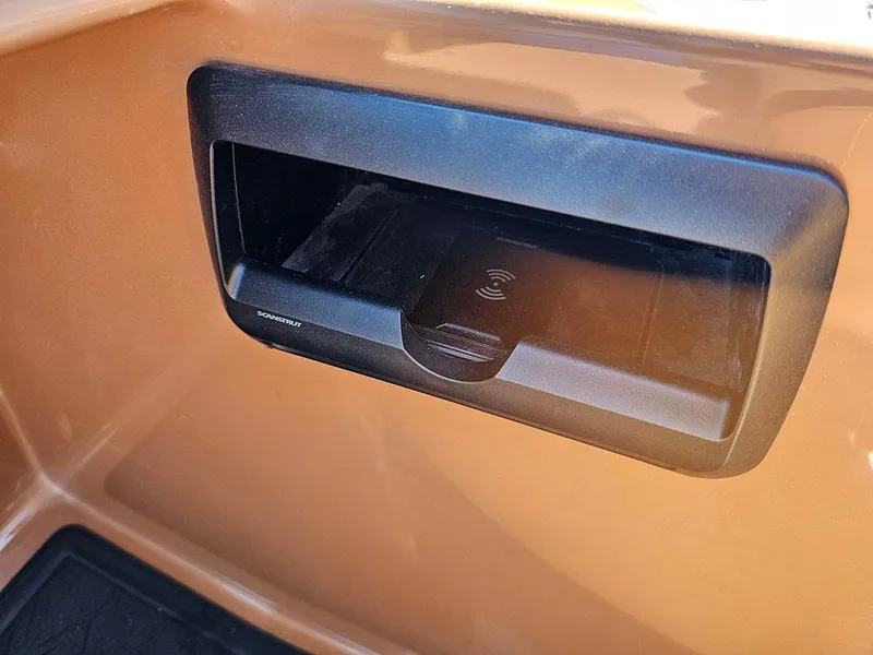 Slide: The Image of 2025 Bentley Pontoons 223 Elite Swingback Tritoon, wireless charging dock detail. - 26