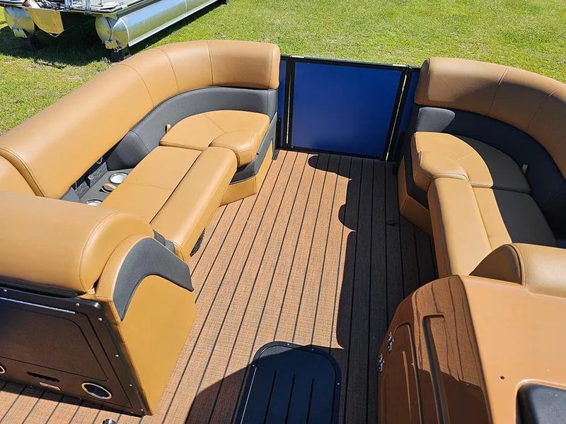 Slide: The Image of 2025 Bentley Pontoons 223 Elite Swingback interior with tan seating and wood flooring. - 30