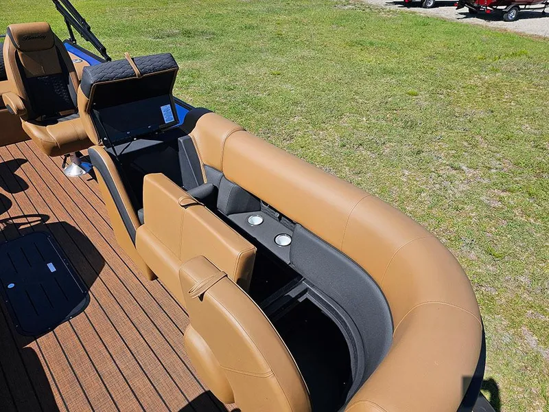 Slide: The Image of 2025 Bentley Pontoons 223 Elite Swingback interior with tan seating and cup holders. - 32