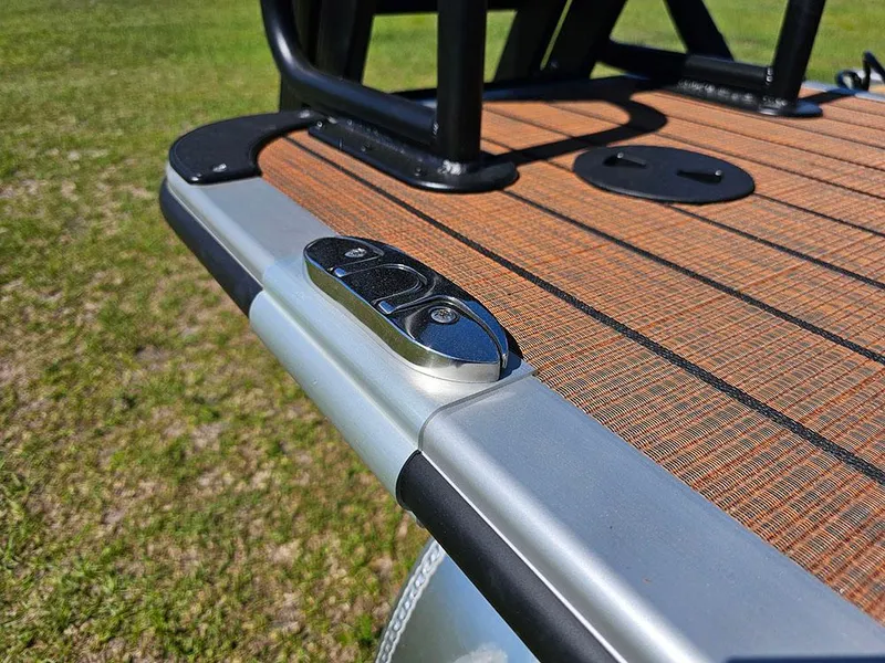 Slide: The Image of 2025 Bentley Pontoons 223 Elite Swingback Tritoon deck detail with sleek design and modern features. - 37
