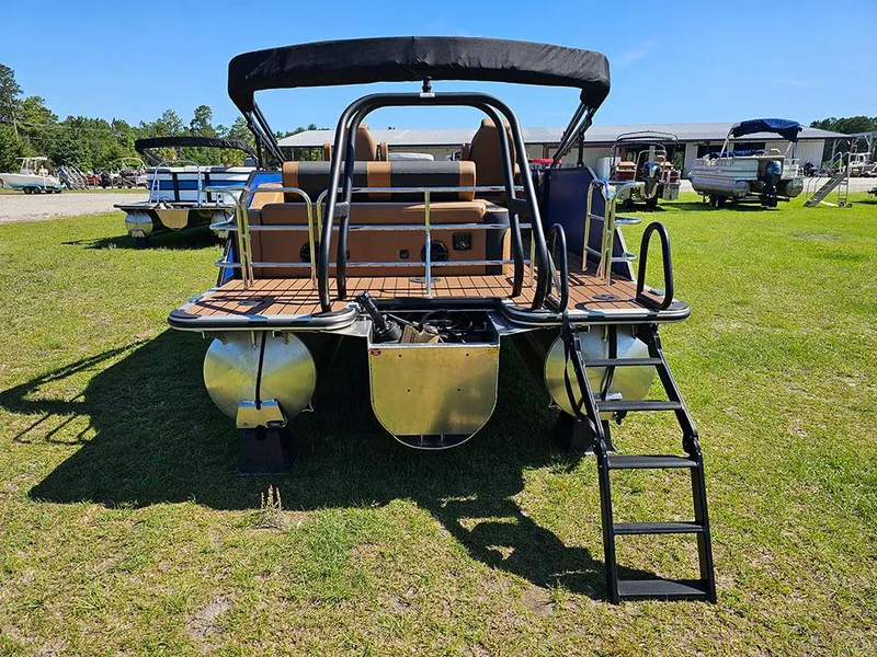 Slide: The Image of 2025 Bentley Pontoons 223 Elite Swingback Tritoon on grass, rear view with ladder. - 8