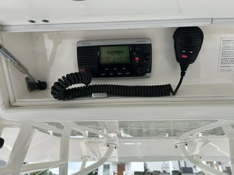 Slide: The Image of VHF radio and microphone on a 2014 Regulator 34 boat console. - 12