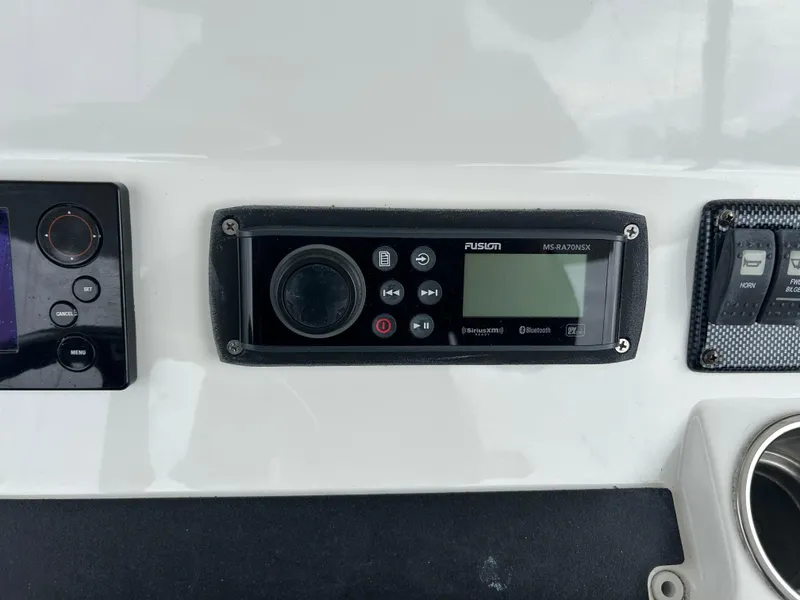 Slide: The Image of Fusion marine stereo system on 2014 Regulator 34 boat dashboard. - 15