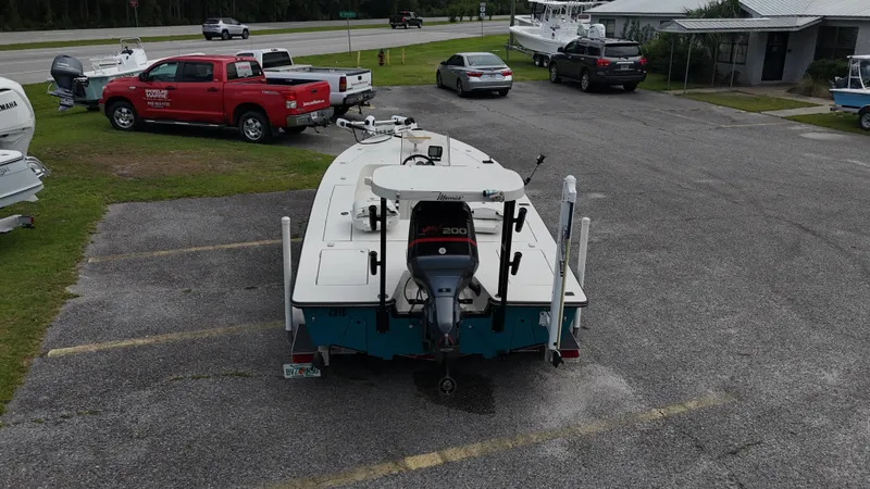 Slide: The Image of 1999 Maverick 21 Master Angler boat parked in a lot, rear view. - 3