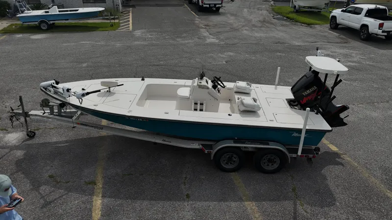 Slide: The Image of 1999 Maverick 21 Master Angler boat on trailer in parking lot. - 6