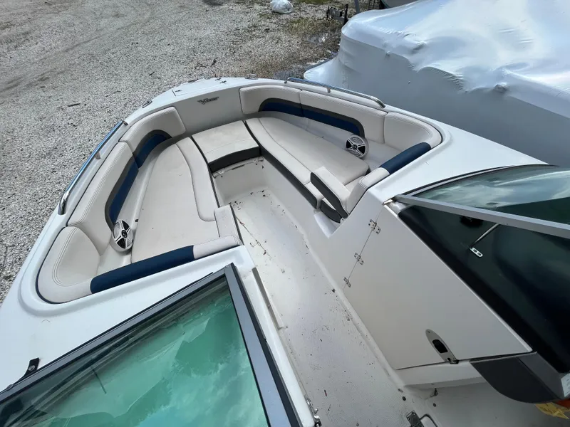 Slide: The Image of 2018 Chaparral Vortex 243 boat interior with spacious seating and modern design. - 11