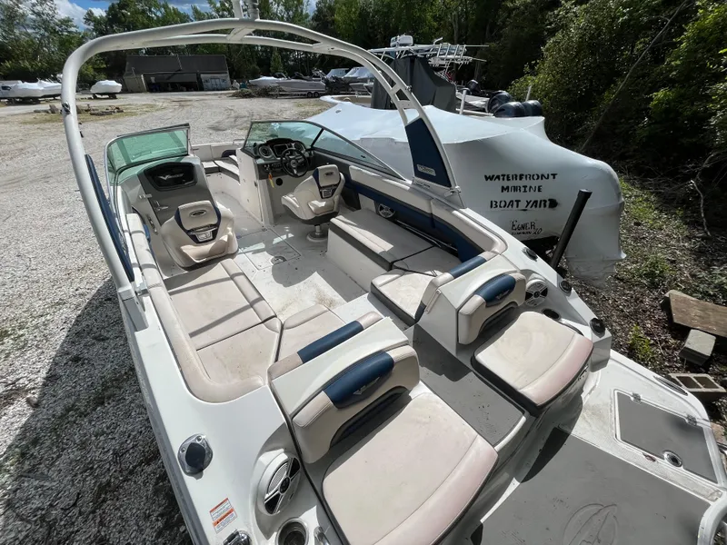 Slide: The Image of 2018 Chaparral Vortex 243 boat with spacious seating at a boatyard. - 6
