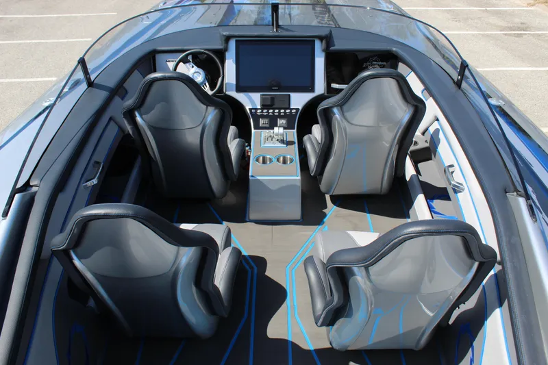 Slide: The Image of 2025 Fountain 34 Thundercat interior with four sleek seats and modern dashboard. - 10