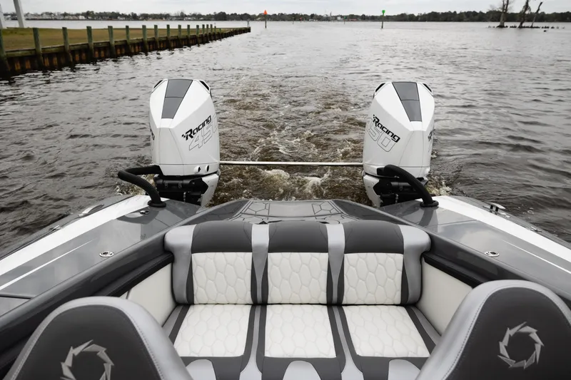 Slide: The Image of 2025 Fountain 34 Thundercat boat with dual engines on a calm waterway. - 14