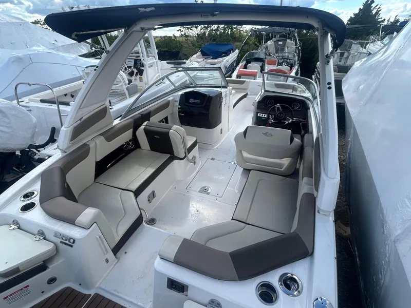 Slide: The Image of 2019 Chaparral 250 Suncoast boat with spacious seating and sleek design. - 14