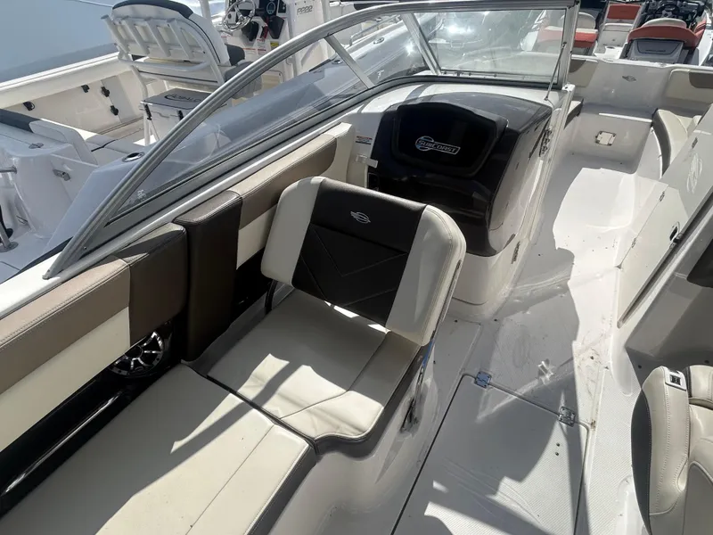 Slide: The Image of 2019 Chaparral 250 Suncoast boat interior with seating and helm. - 20