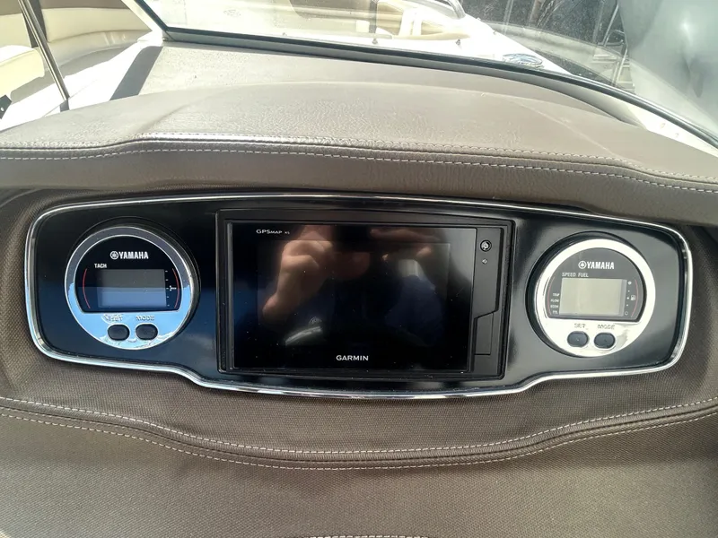 Slide: The Image of Dashboard of 2019 Chaparral 250 Suncoast with Yamaha gauges and Garmin display. - 23