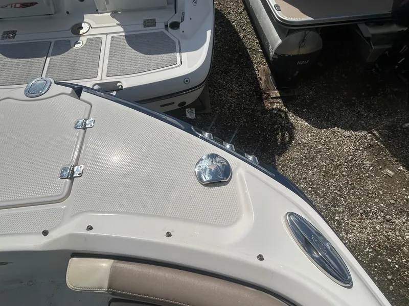 Slide: The Image of 2019 Chaparral 250 Suncoast boat deck with seating and storage compartments. - 40