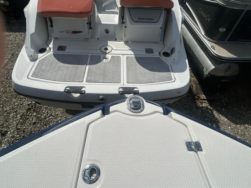 Slide: The Image of 2019 Chaparral 250 Suncoast boat stern and swim platform, featuring seating and storage. - 43