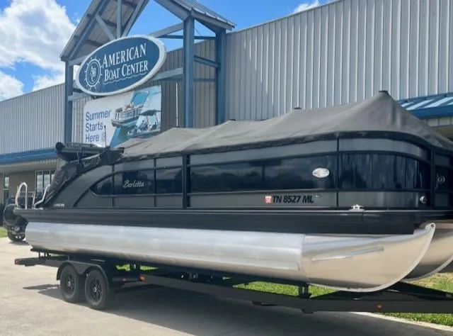 Slide: The Image of 2020 Barletta L25QCSS pontoon boat at American Boat Center, covered and on a trailer. - 0