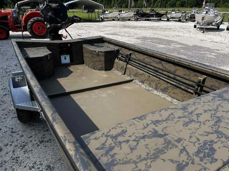 Slide: The Image of 2025 Gator Tail 1754 Extreme Series boat with camouflage design in a parking area. - 10