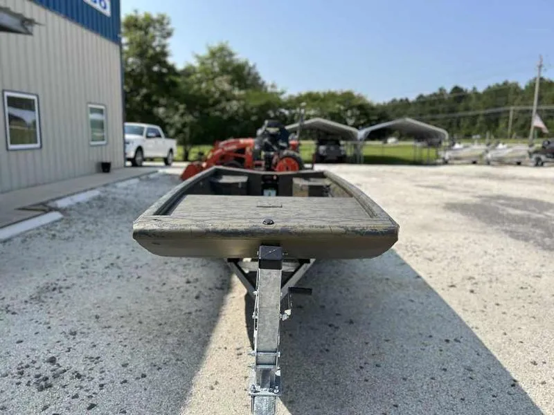 Slide: The Image of 2025 Gator Tail 1754 Extreme Series boat on trailer in outdoor setting. - 2