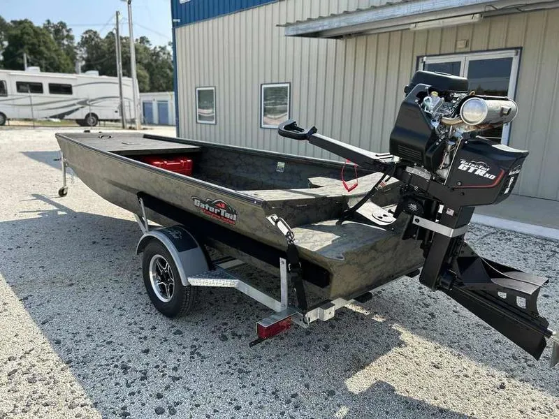 Slide: The Image of 2025 Gator Tail 1754 Extreme Series boat on trailer, parked outside a building. - 4