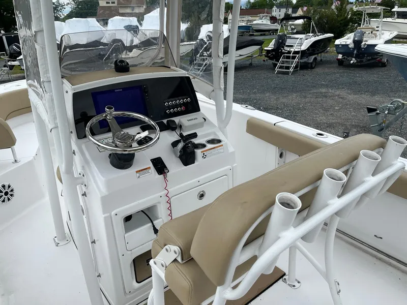 Slide: The Image of 2017 Sportsman Open 232 Center Console boat interior with steering wheel and seating. - 10