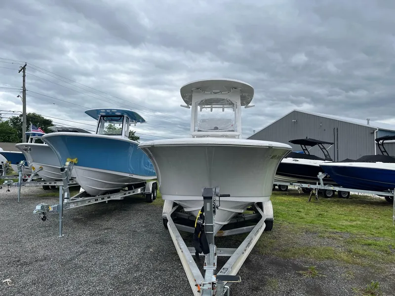 Slide: The Image of 2017 Sportsman Open 232 Center Console boat on trailer, cloudy sky background. - 3