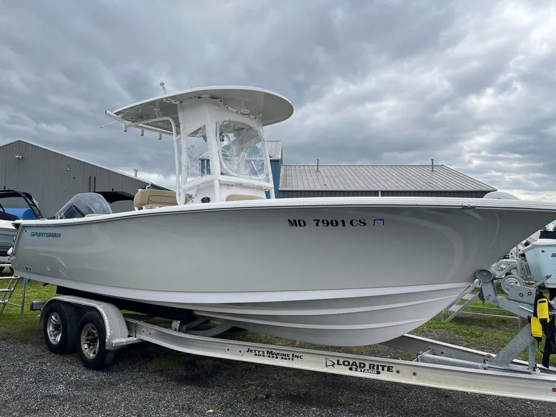 Slide: The Image of 2017 Sportsman Open 232 Center Console boat on trailer, cloudy sky background. - 4