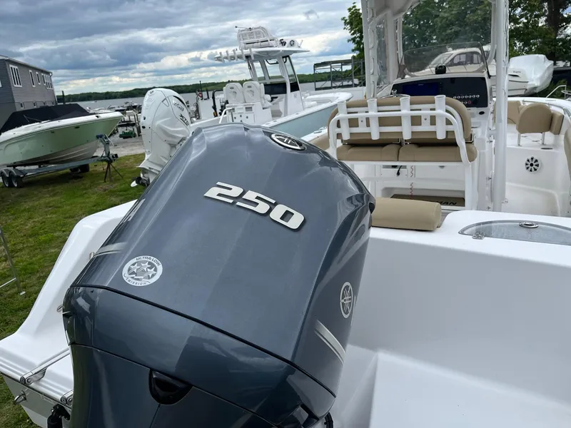 Slide: The Image of 2017 Sportsman Open 232 Center Console with 250 horsepower engine, docked outdoors. - 6
