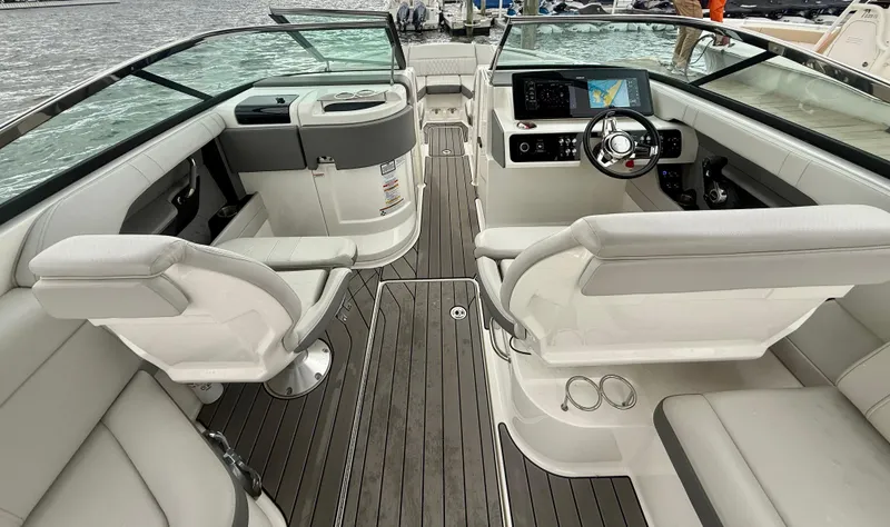 Slide: The Image of 2022 Sea Ray SLX 280 boat interior with modern helm and seating. - 10
