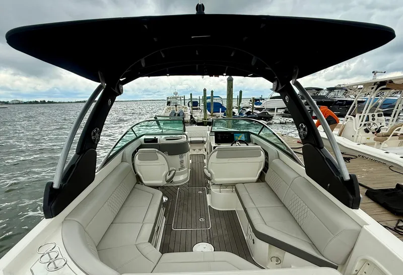 Slide: The Image of 2022 Sea Ray SLX 280 boat interior with spacious seating and sleek design. - 11