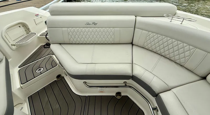 Slide: The Image of 2022 Sea Ray SLX 280 boat interior with luxurious seating and elegant design. - 13
