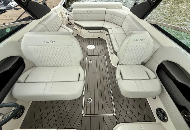 Slide: The Image of Luxurious interior of 2022 Sea Ray SLX 280 boat with elegant seating and wood flooring. - 14