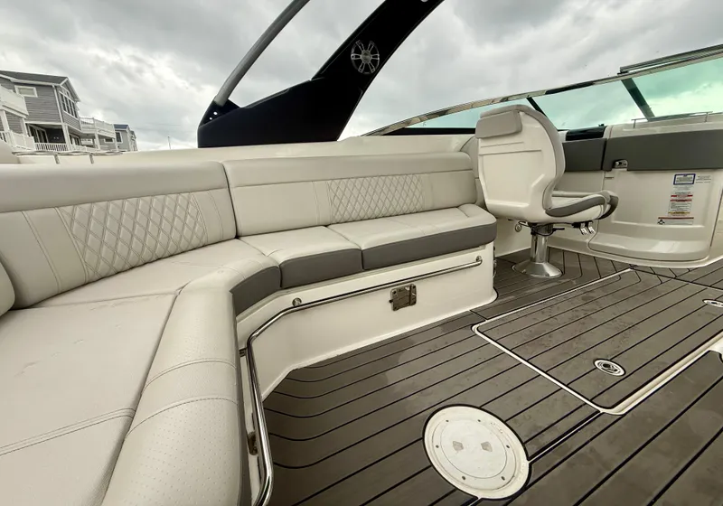 Slide: The Image of 2022 Sea Ray SLX 280 boat interior with luxurious seating and modern design. - 17