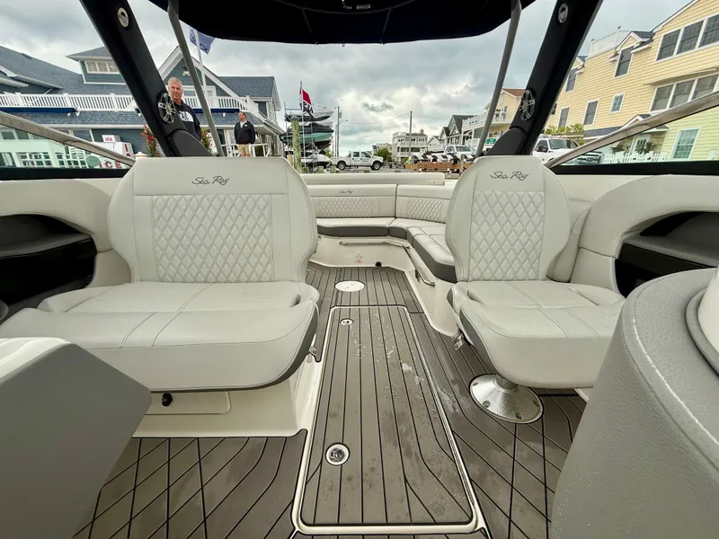 Slide: The Image of 2022 Sea Ray SLX 280 boat interior with luxurious seating and sleek design. - 19