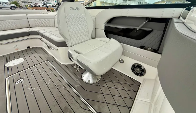 Slide: The Image of Luxurious interior of 2022 Sea Ray SLX 280 boat with elegant seating and flooring. - 21