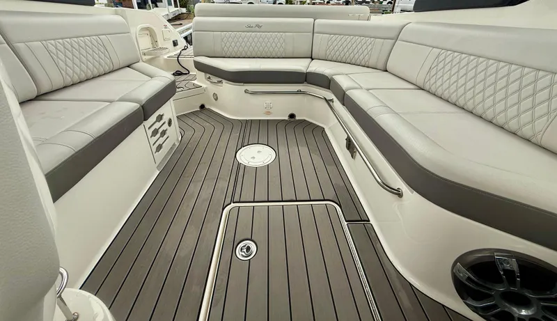 Slide: The Image of Luxurious interior of 2022 Sea Ray SLX 280 boat with elegant seating and teak flooring. - 22