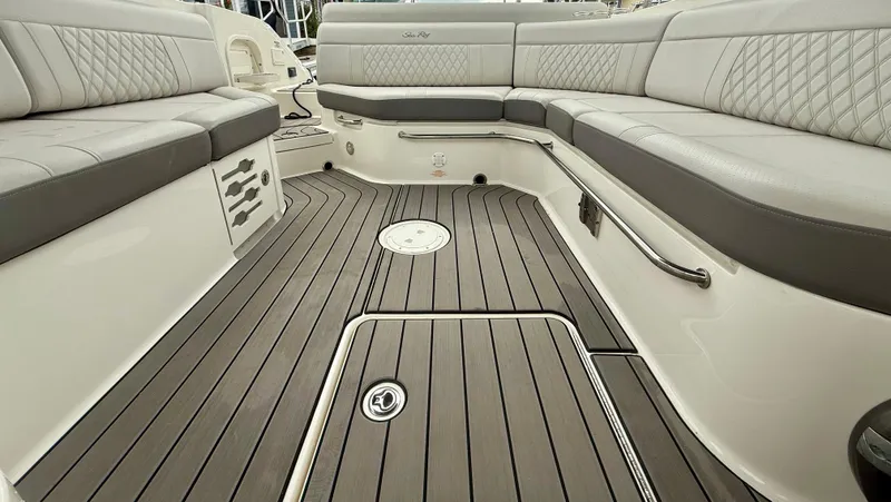 Slide: The Image of 2022 Sea Ray SLX 280 boat interior with luxurious seating and sleek flooring. - 23