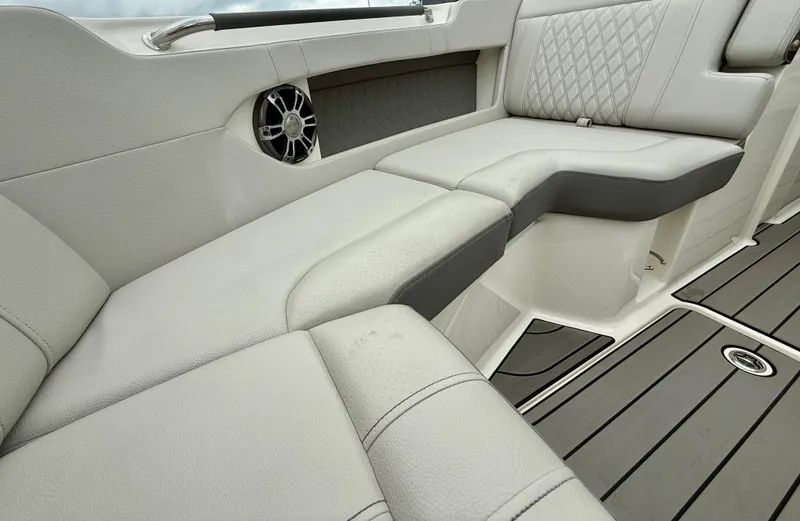 Slide: The Image of Luxurious seating on 2022 Sea Ray SLX 280 boat with elegant upholstery and speaker. - 24