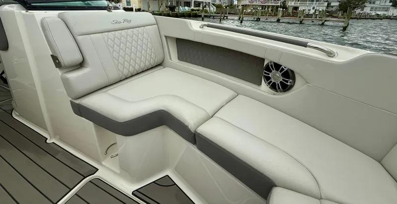Slide: The Image of 2022 Sea Ray SLX 280 boat interior with luxurious seating and speaker system. - 25