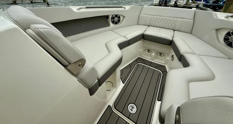 Slide: The Image of Luxurious seating area on 2022 Sea Ray SLX 280 boat, featuring elegant upholstery and modern design. - 28