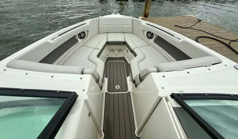 Slide: The Image of 2022 Sea Ray SLX 280 boat interior with luxurious seating and sleek design. - 29