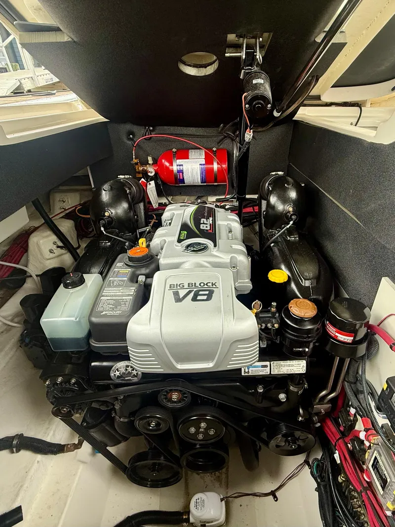 Slide: The Image of Engine compartment of a 2022 Sea Ray SLX 280 boat, featuring a Big Block V8 engine. - 32