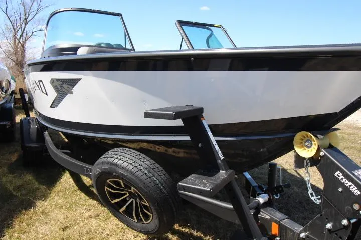 Slide: The Image of 2025 Lund 1775 Crossover XS boat on trailer, side view, outdoors. - 1