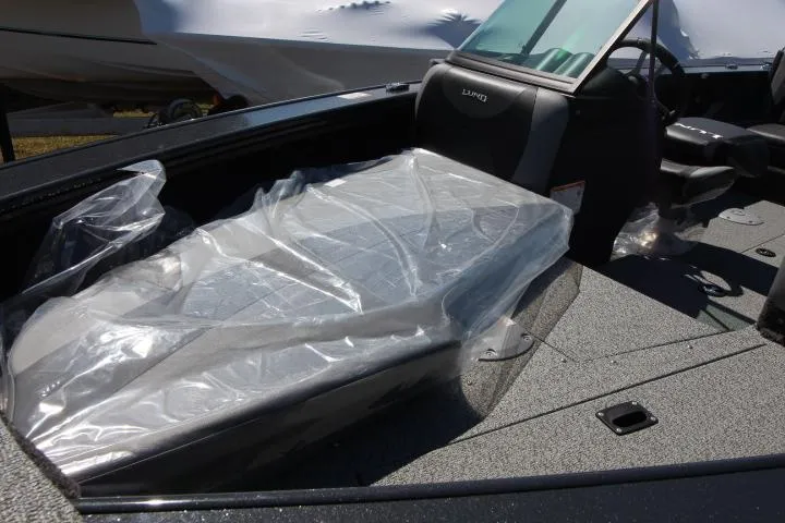 Slide: The Image of 2025 Lund 1775 Crossover XS boat interior with protective plastic covering. - 4