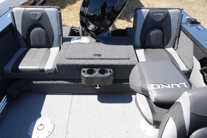 Slide: The Image of 2025 Lund 1775 Crossover XS boat interior with seating and cup holders. - 5
