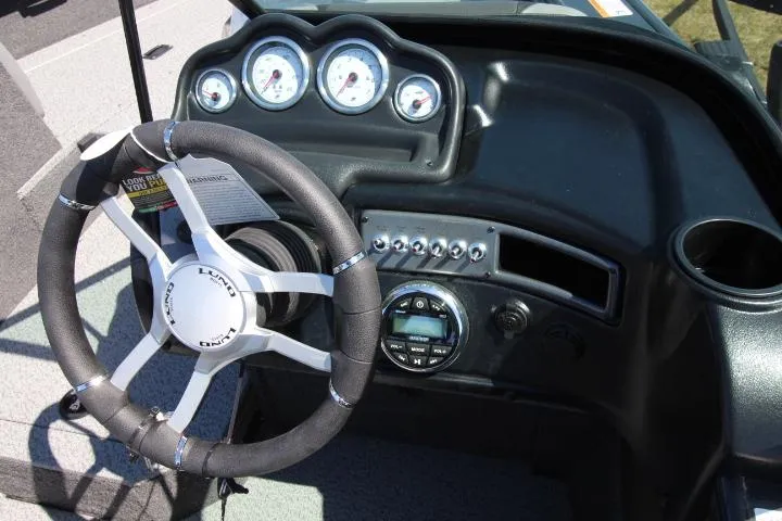 Slide: The Image of 2025 Lund 1775 Crossover XS dashboard with steering wheel and gauges. - 6