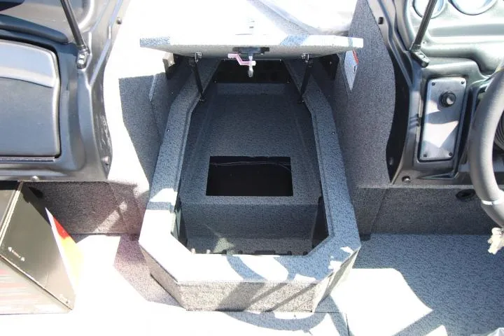 Slide: The Image of 2025 Lund 1775 Crossover XS boat interior storage compartment, open and empty. - 8