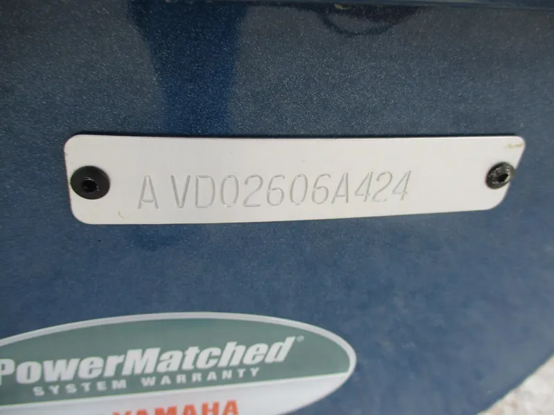 Slide: The Image of 2024 Avid 18XB boat with PowerMatched Yamaha warranty label and serial number plate. - 9