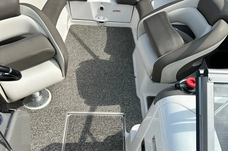 Slide: The Image of Interior of 2011 Yamaha 242 Limited Jet Boat with gray carpet and cushioned seating. - 4