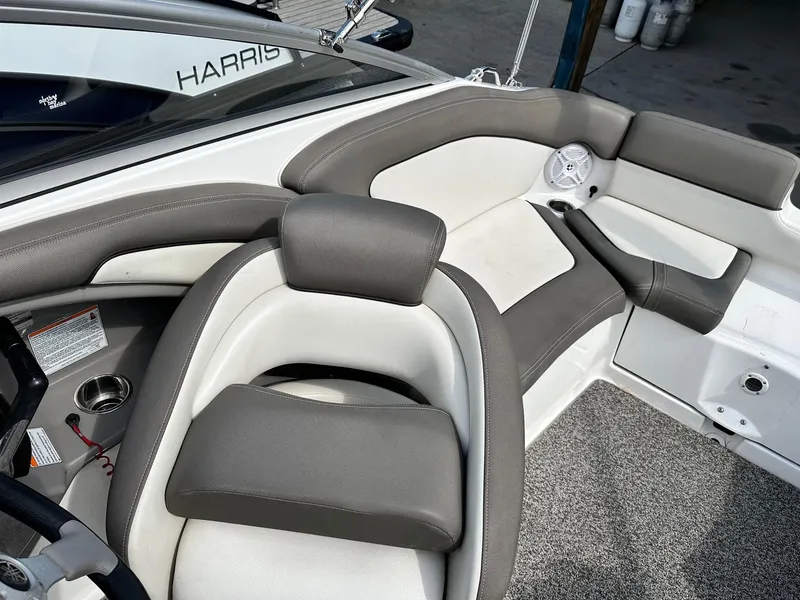 Slide: The Image of 2011 Yamaha 242 Limited Jet Boat interior with gray and white seating. - 6