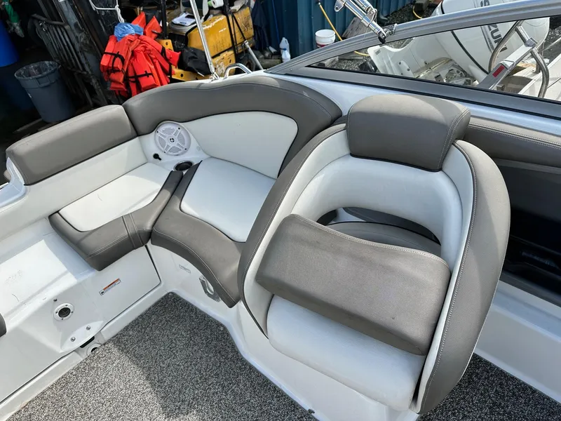 Slide: The Image of 2011 Yamaha 242 Limited Jet Boat interior seating with gray and white upholstery. - 7